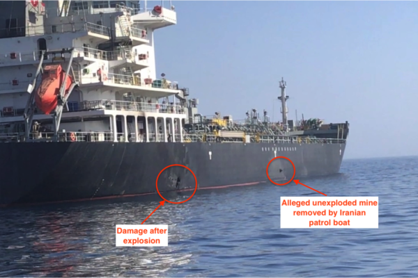 A tanker with hull damage and an unexploded limpet mine attached to its side, in a file photo from the 2019 Gulf of Oman incident.
