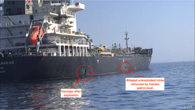 A tanker with hull damage and an unexploded limpet mine attached to its side, in a file photo from the 2019 Gulf of Oman incident.