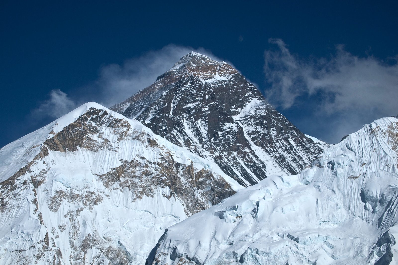 Mount Everest rising above clouds in the Himalayas in Nepal.