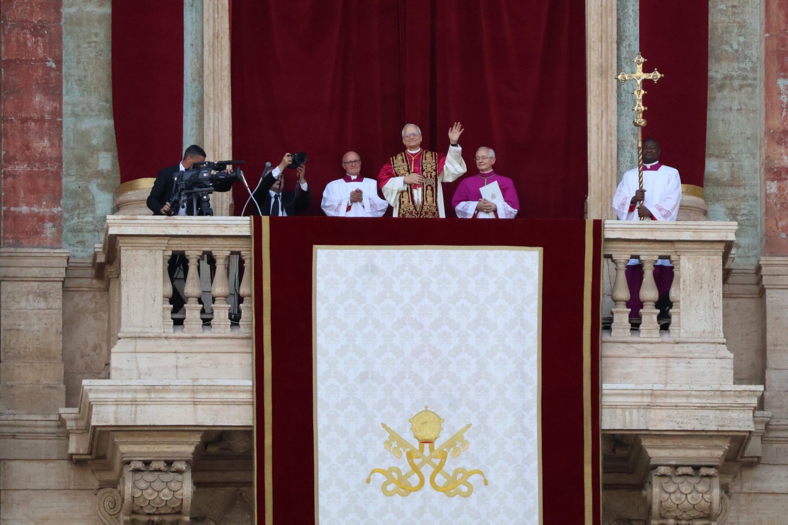 Pope Leo XIV greets crowds from the loggia of St Peter's Basilica after his election in May 2025.